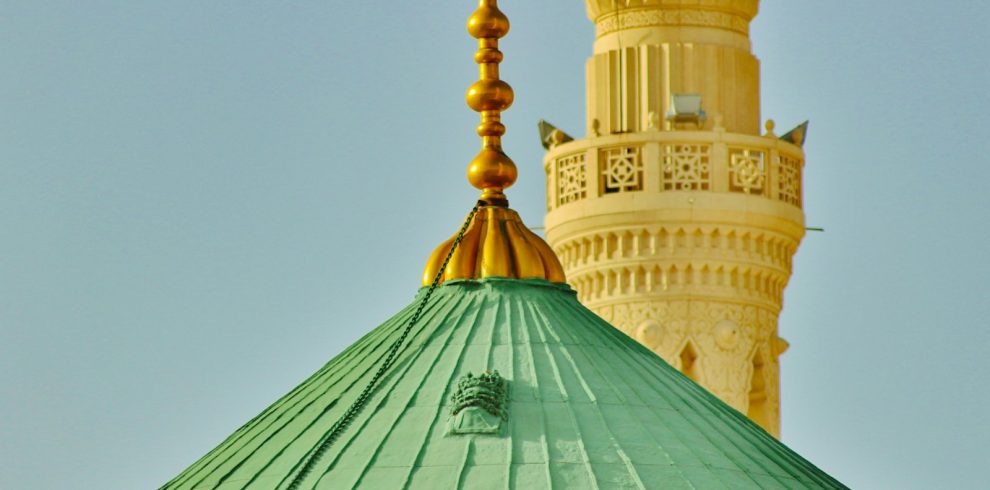 a large green dome with a gold top